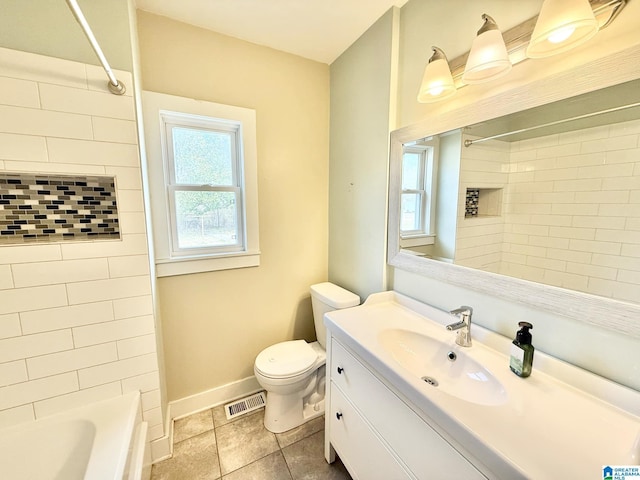 bathroom with visible vents, toilet, washtub / shower combination, vanity, and baseboards