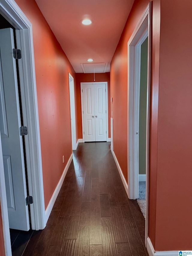 hall with dark hardwood / wood-style flooring