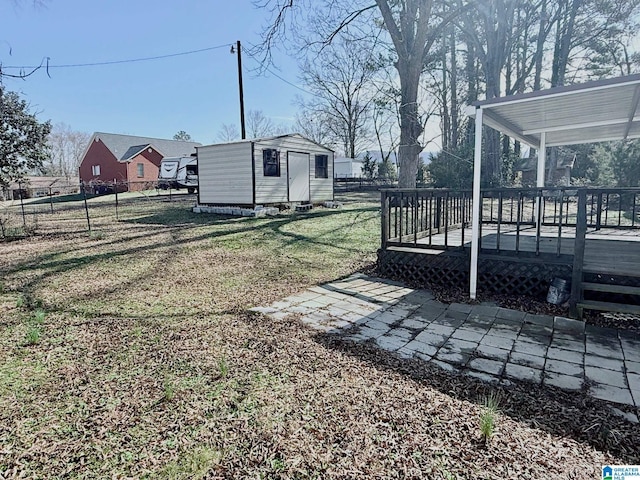 view of yard with a shed and a deck