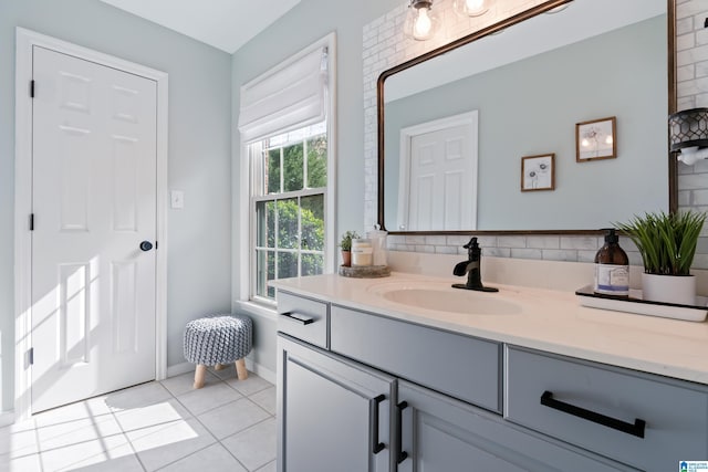 bathroom with tile patterned flooring and vanity