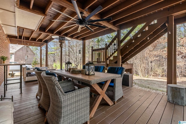 wooden terrace featuring ceiling fan