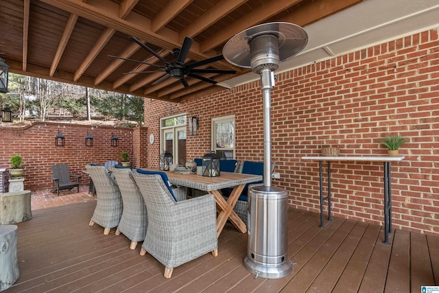 wooden deck featuring ceiling fan