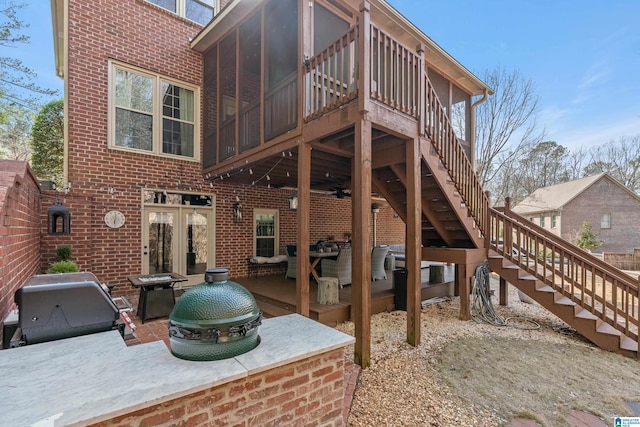 back of property featuring a patio and ceiling fan