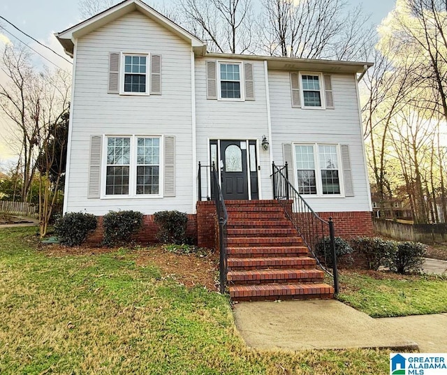 view of front of property with a front lawn