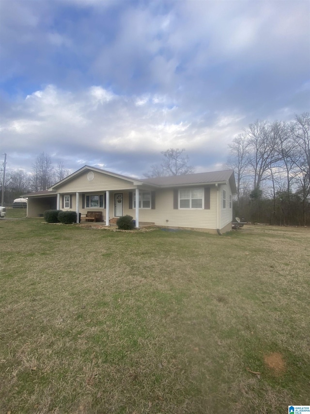 view of front of home with covered porch and a front yard