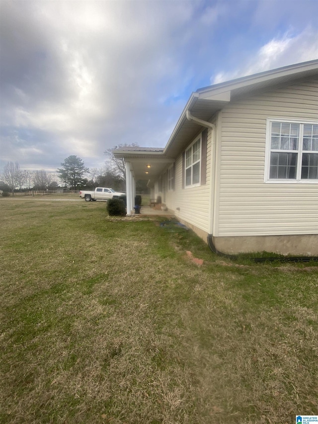 view of home's exterior featuring a lawn