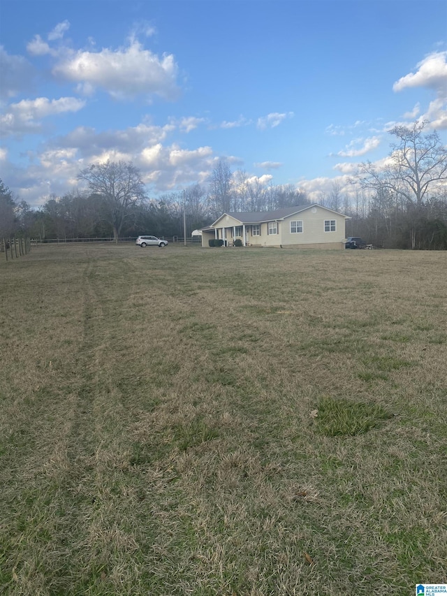 view of yard with a rural view