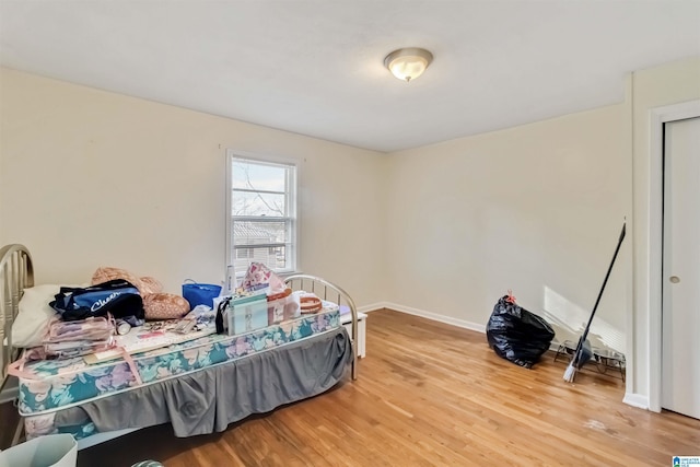 bedroom featuring wood-type flooring