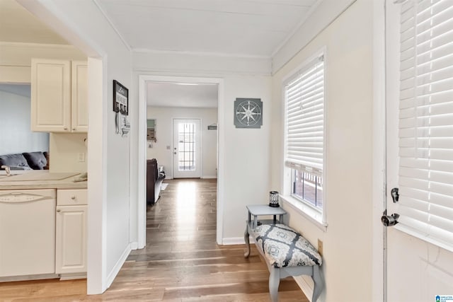 hallway featuring crown molding and wood-type flooring