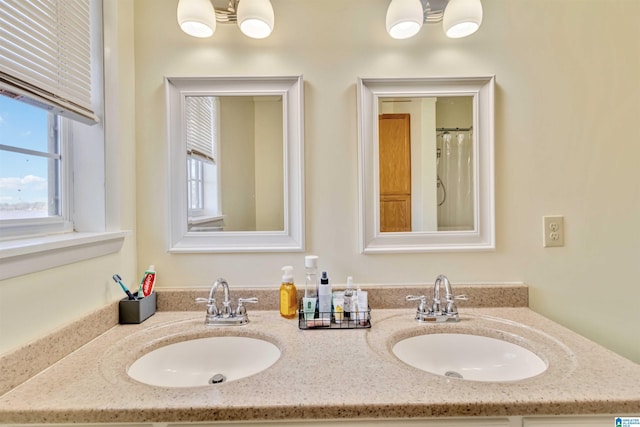 bathroom featuring vanity and a chandelier