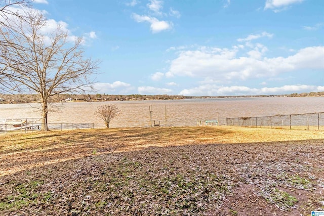 view of yard featuring a rural view and a water view