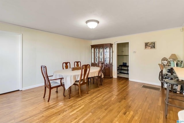 dining area with light hardwood / wood-style flooring