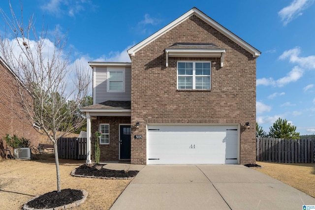 front of property featuring a garage and central air condition unit