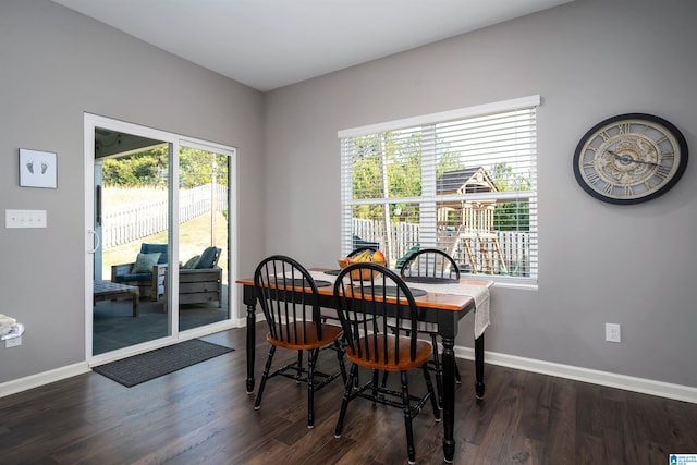 dining area featuring dark hardwood / wood-style flooring