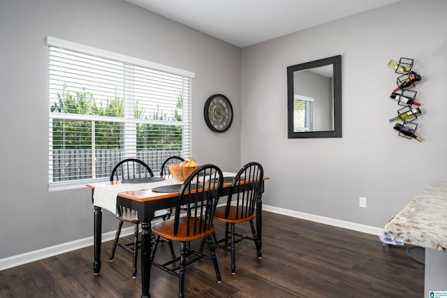 dining area featuring dark hardwood / wood-style flooring