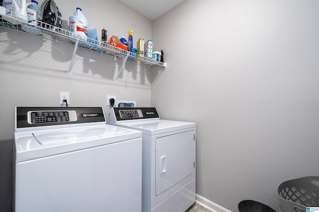 laundry room featuring washer and clothes dryer