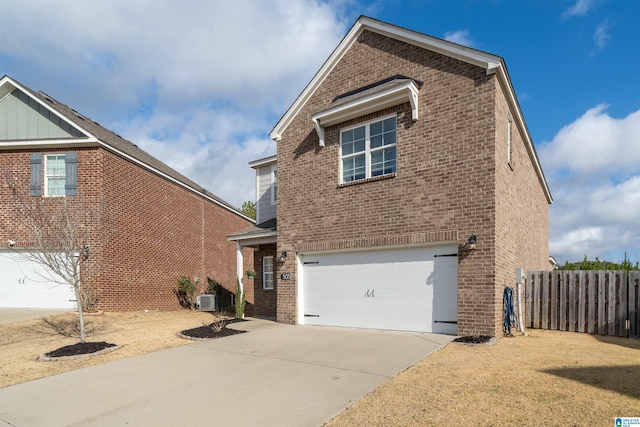 view of front facade with a garage and central air condition unit