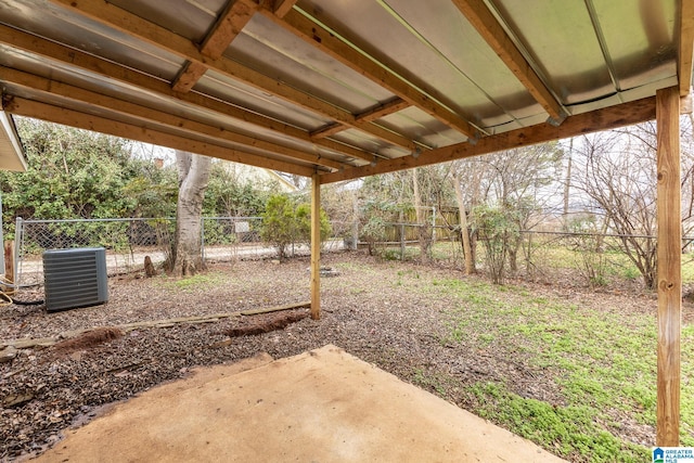 view of yard with central AC unit and a patio area