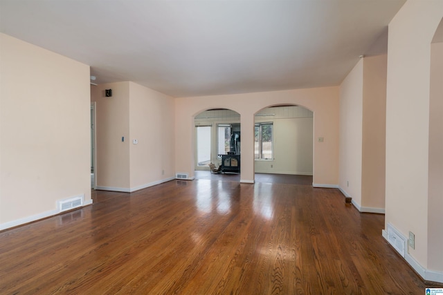 spare room with dark wood-type flooring