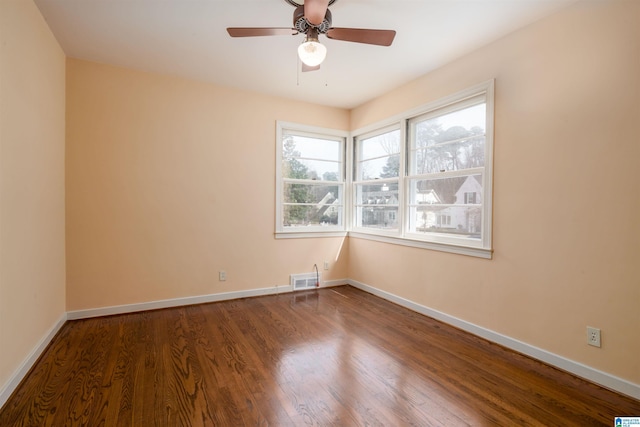 empty room featuring ceiling fan and wood-type flooring