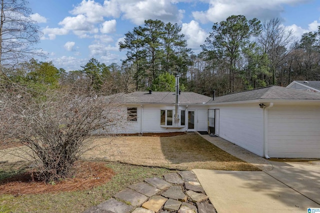 back of property featuring a patio area