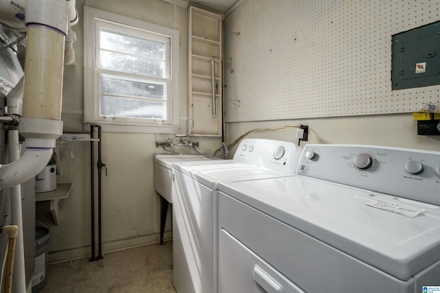 laundry area featuring washer and dryer and electric panel