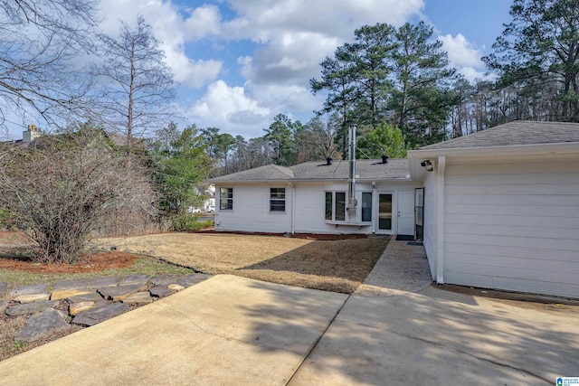 rear view of property featuring a patio