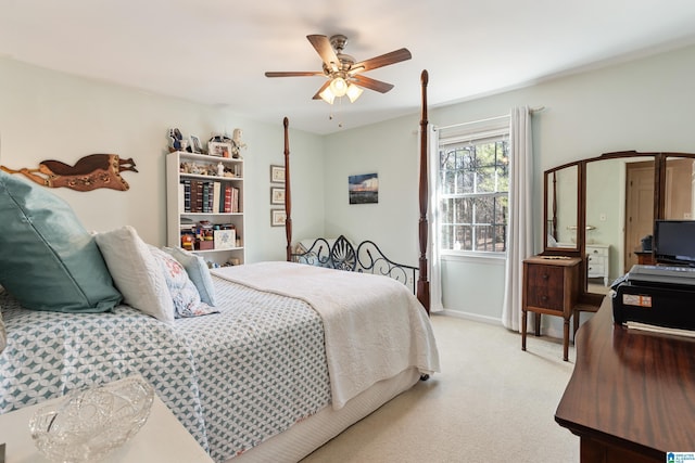 bedroom featuring light colored carpet and ceiling fan