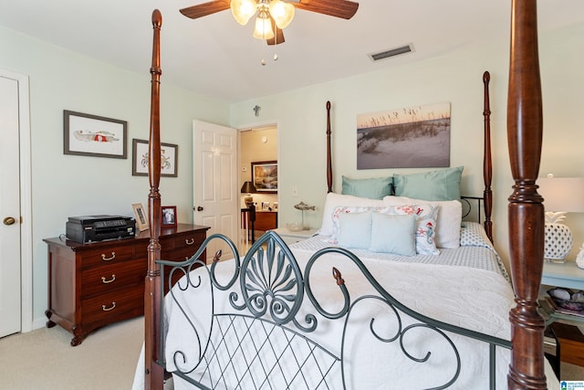 bedroom featuring light colored carpet and ceiling fan