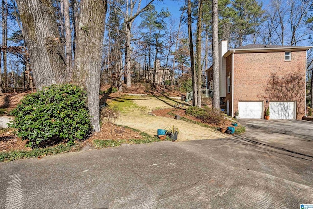 view of yard featuring a garage