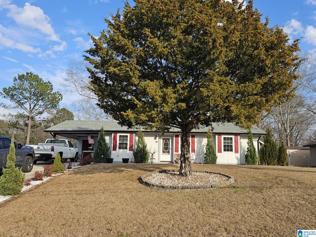 ranch-style house with a front lawn and a carport