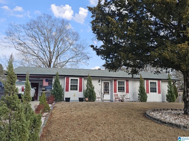 ranch-style home with a front lawn