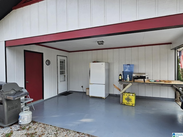 garage with white refrigerator