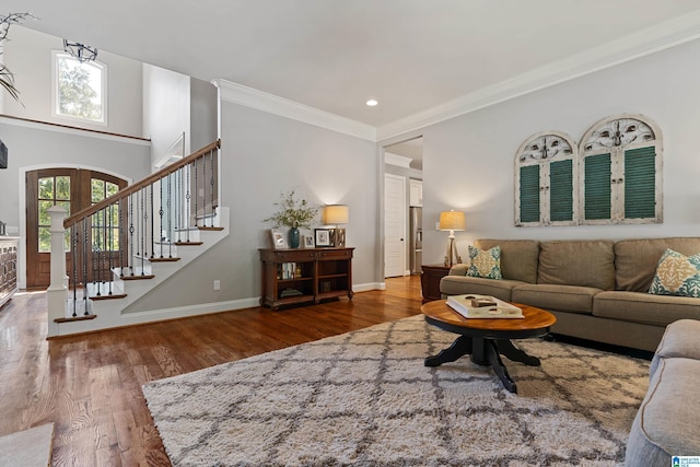 living room featuring ornamental molding, dark hardwood / wood-style floors, and french doors