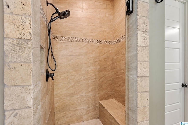 bathroom featuring tiled shower