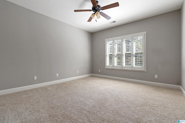 carpeted empty room with ceiling fan