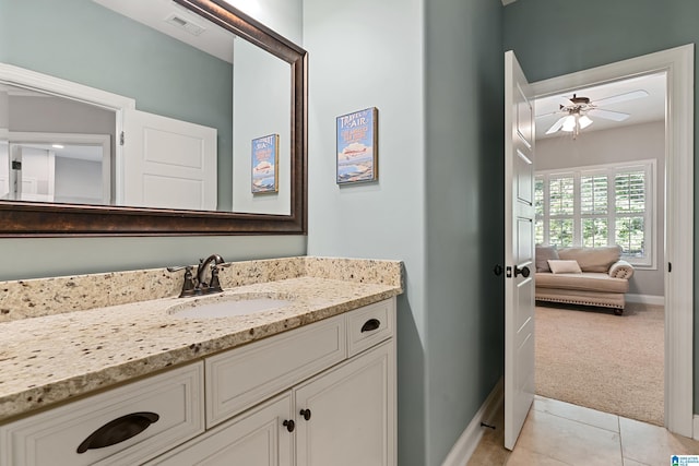 bathroom with ceiling fan, tile patterned floors, and vanity