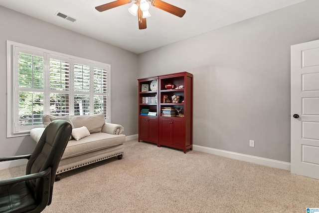 office with ceiling fan and light colored carpet