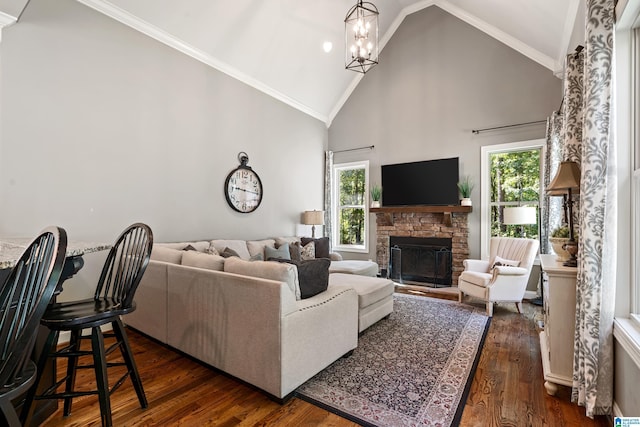 living room featuring a fireplace, dark wood-type flooring, high vaulted ceiling, and a healthy amount of sunlight