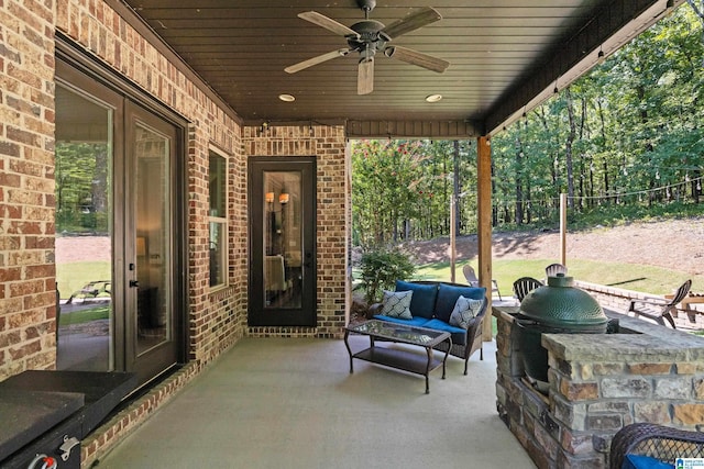 view of patio / terrace featuring ceiling fan and an outdoor living space