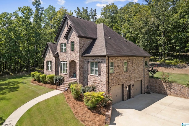 view of front facade with a garage and a front yard