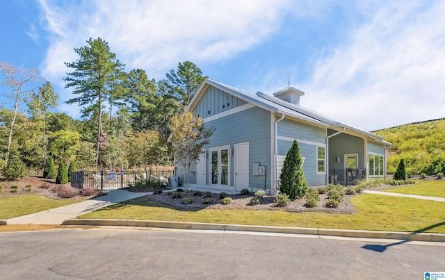 view of property exterior with a yard