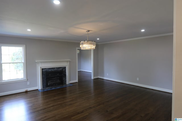 unfurnished living room featuring dark hardwood / wood-style floors, a fireplace, and crown molding