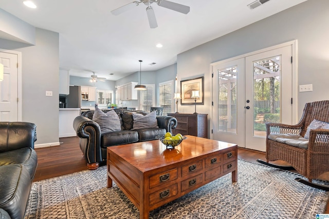 living room featuring french doors, hardwood / wood-style floors, and ceiling fan