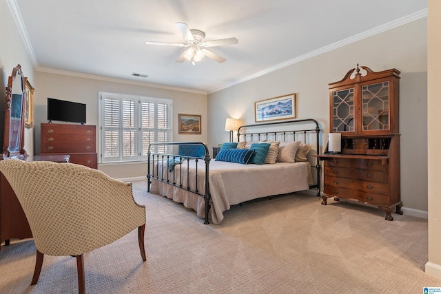 carpeted bedroom with crown molding and ceiling fan