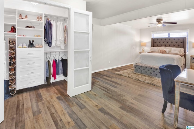 bedroom featuring ceiling fan and dark hardwood / wood-style flooring