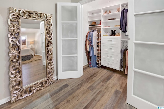 walk in closet featuring dark hardwood / wood-style floors