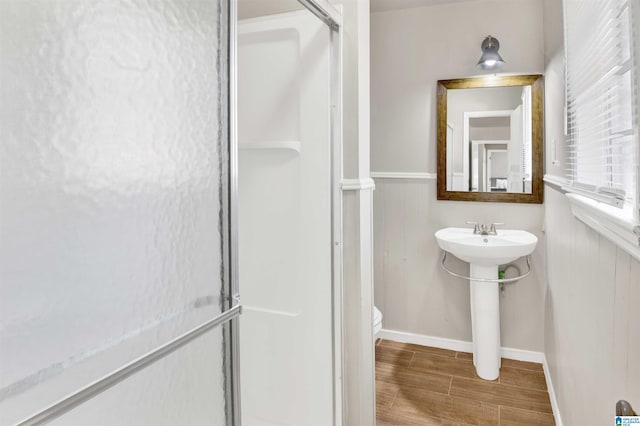 bathroom with toilet and walk in shower