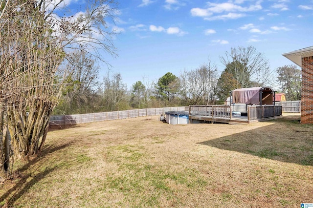 view of yard featuring a swimming pool side deck