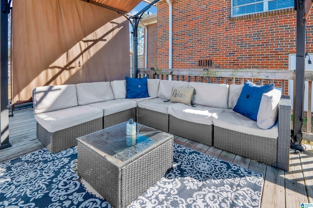 view of patio featuring a wooden deck and outdoor lounge area